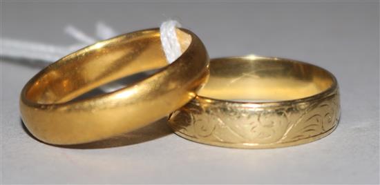 One 22ct gold band and one 18ct gold band,